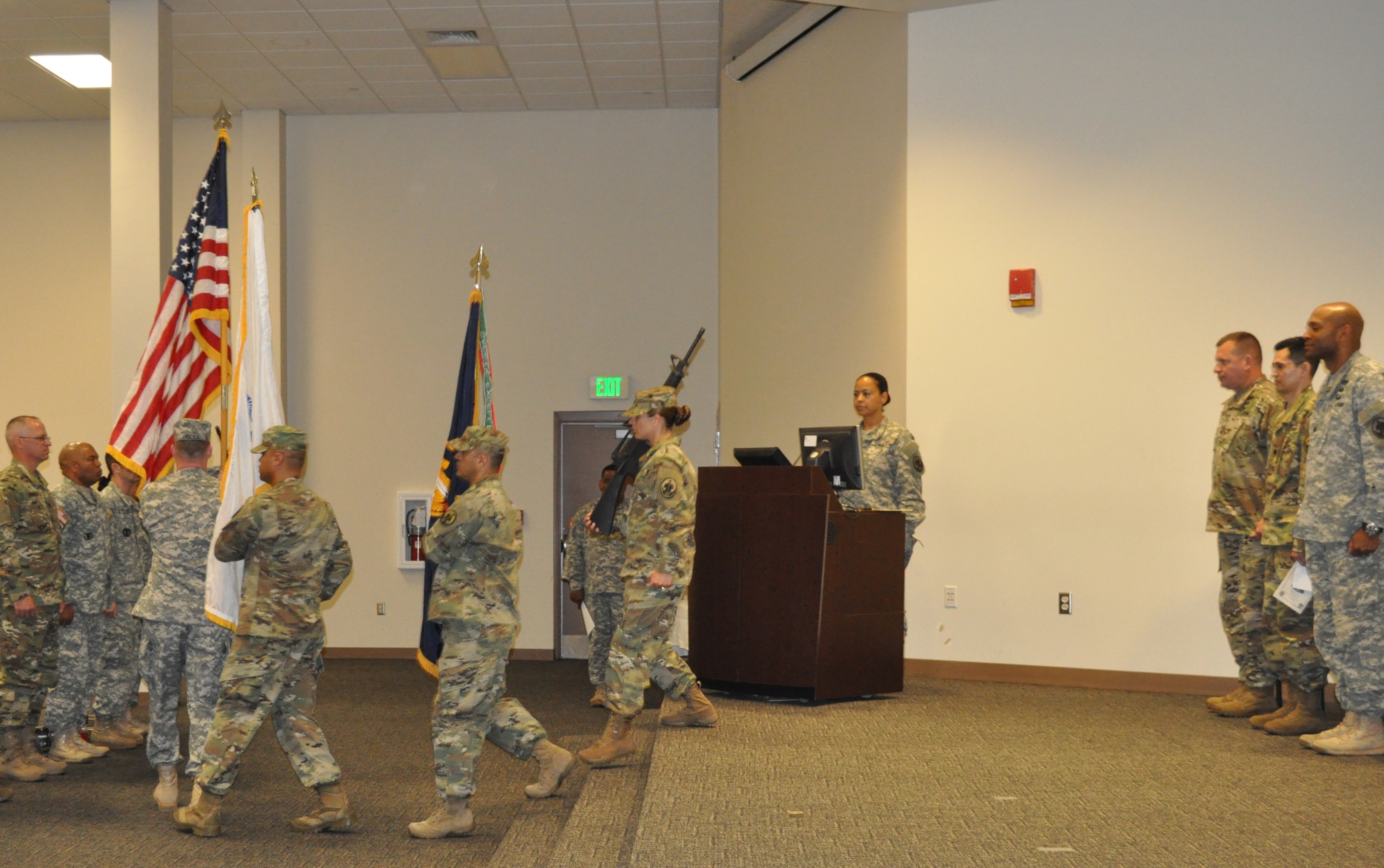 6th Battalion ARCD ceremony, color guard marching with flags