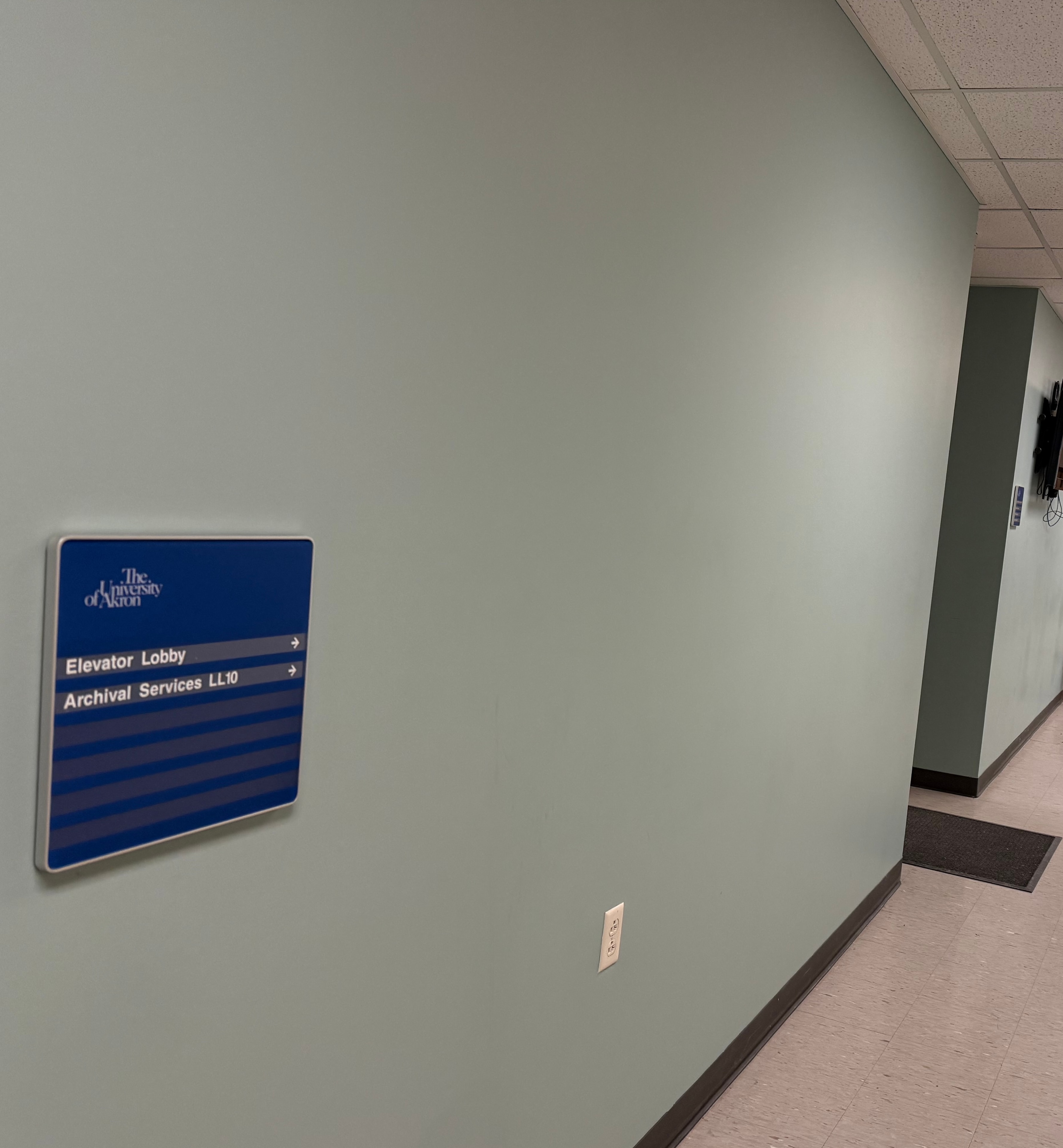 University of Akron Archives direction sign and elevator lobby