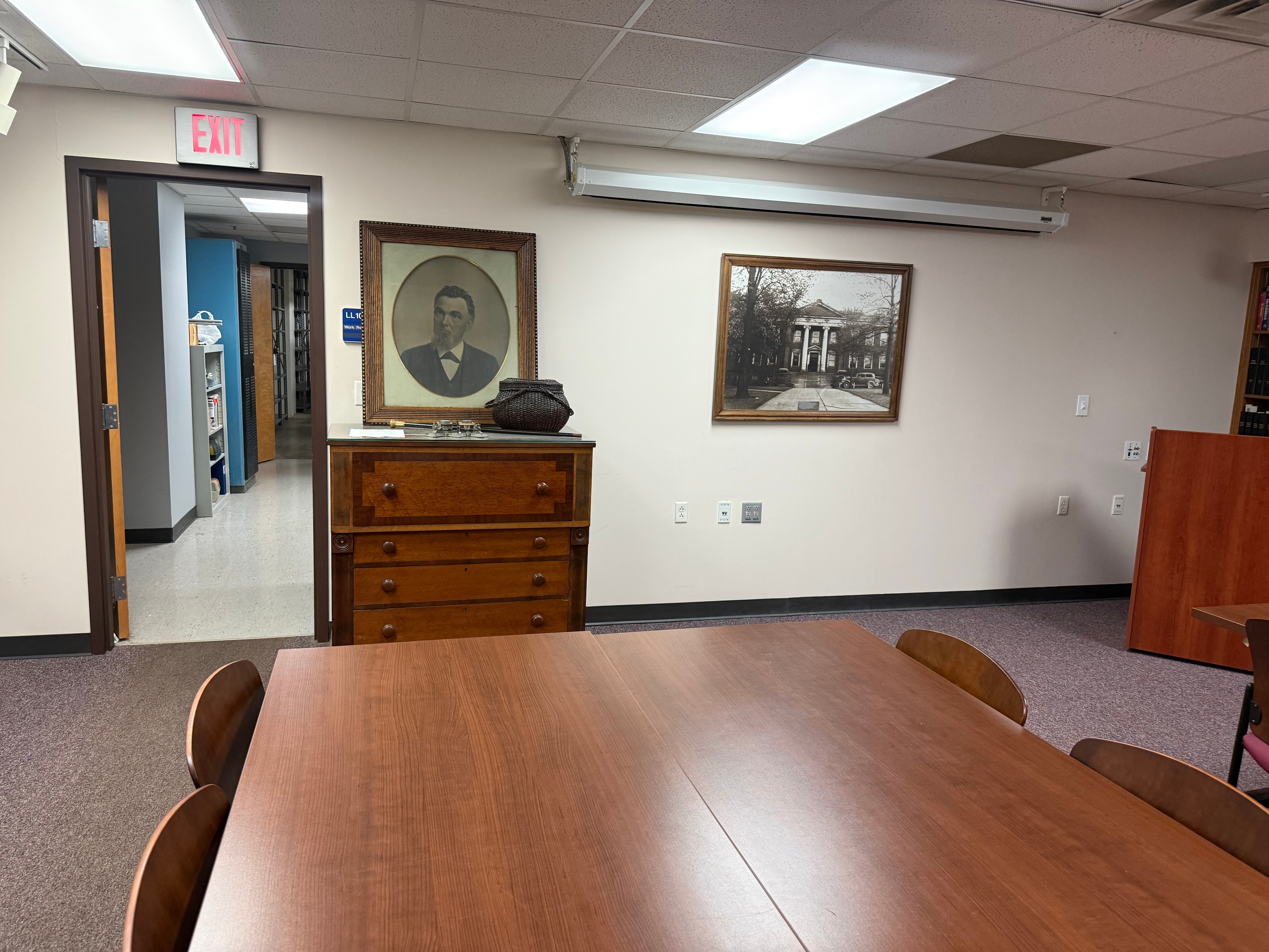 University of Akron Archives instruction and reading room with period furnishings and framed portraits