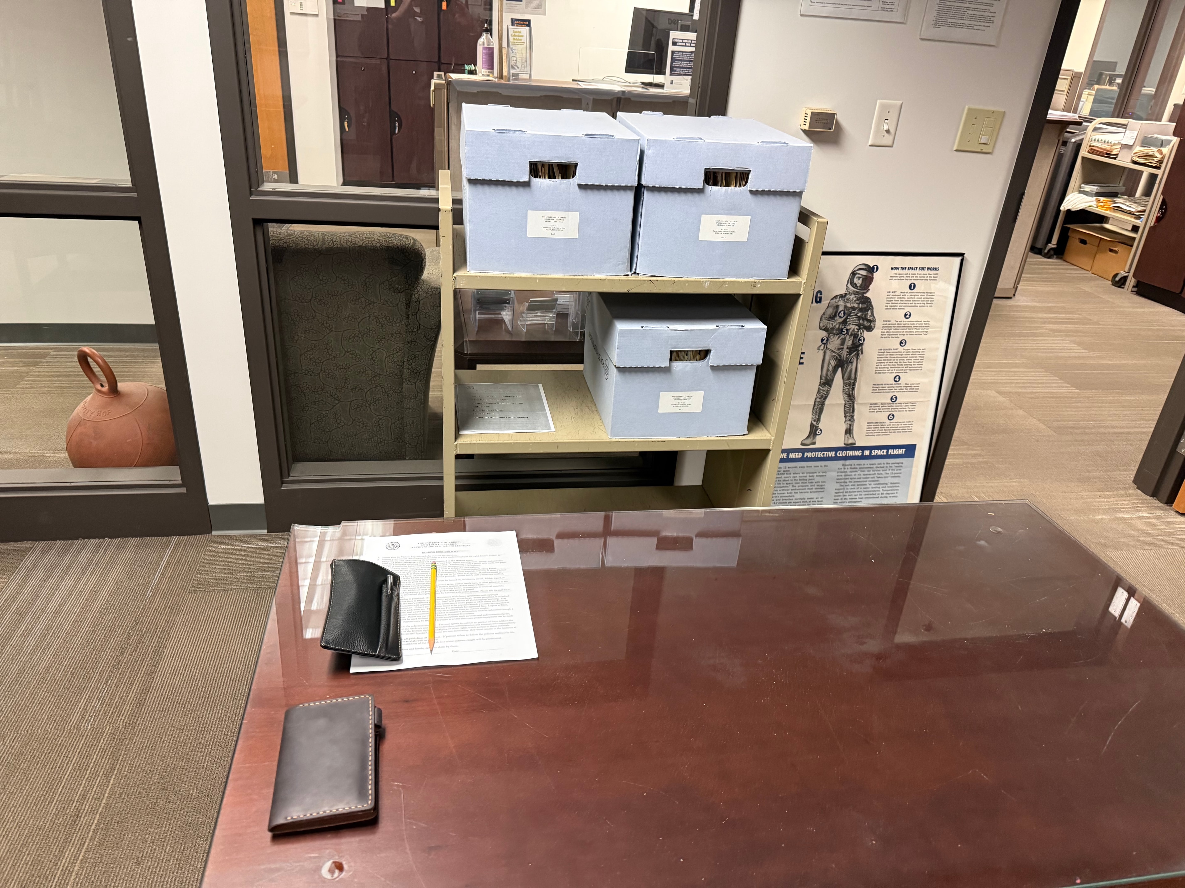 University of Akron Archives research room with archival storage boxes and consultation table