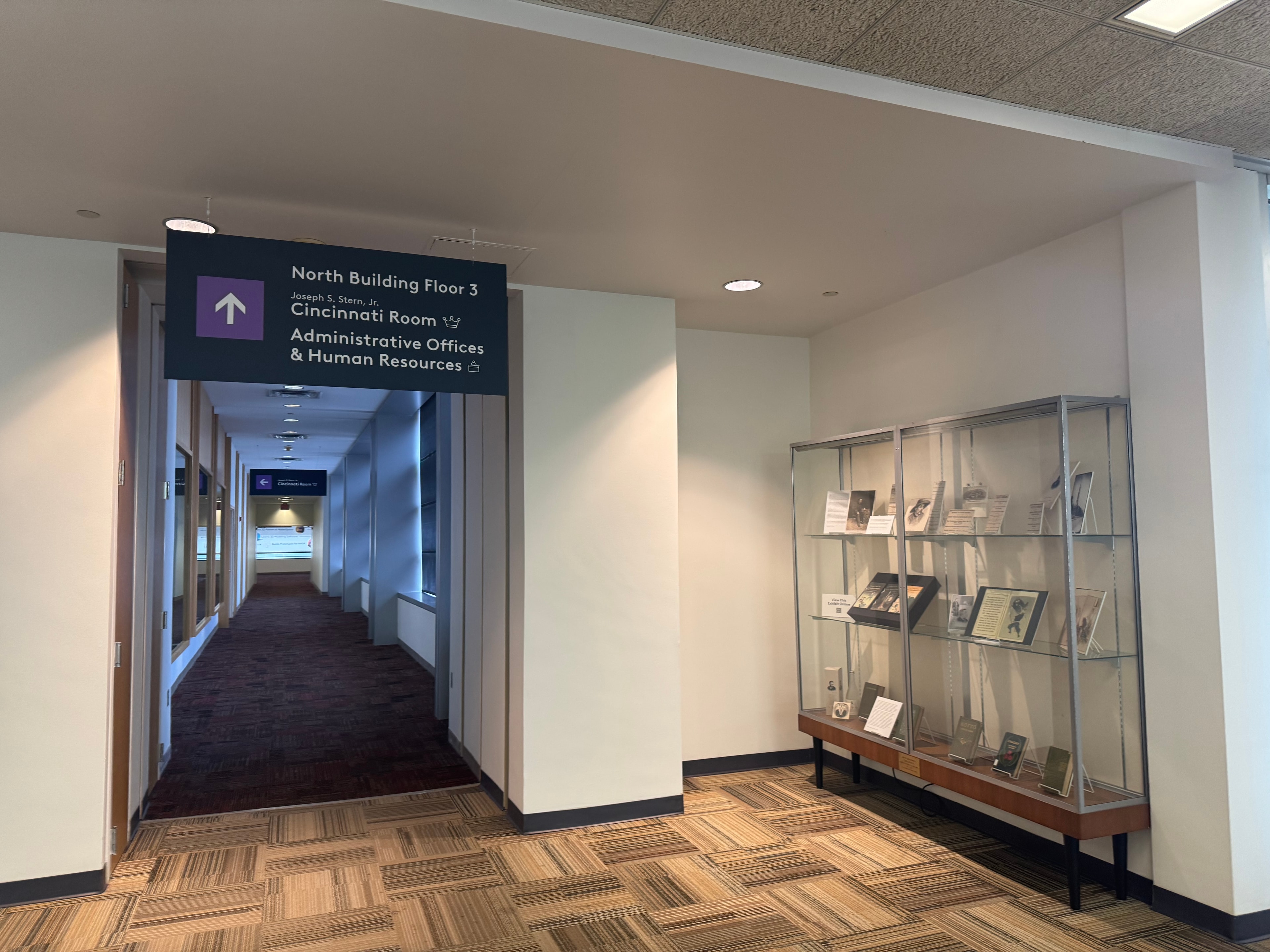 Cincinnati Public Library interior hallway with wayfinding signage to Cincinnati Room